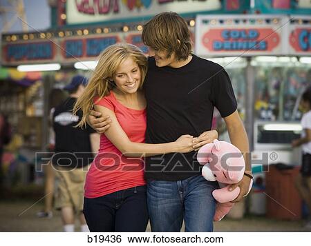 Stock Photograph - young couple at an amusement park. Fotosearch