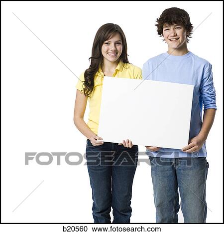 young couple holding a sign View Large Photo Image Stock Image - young couple holding a sign. Fotosearch