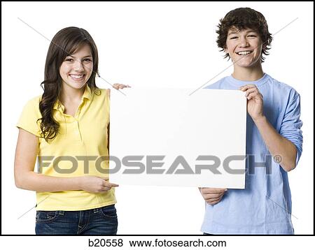 young couple holding a sign View Large Photo Image Stock Photo - young couple holding a sign. Fotosearch