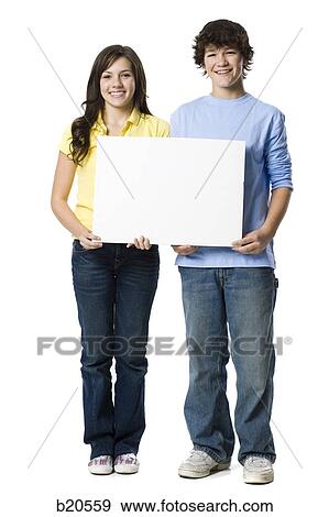young couple holding a sign View Large Photo Image Stock Photo - young couple holding a sign. Fotosearch