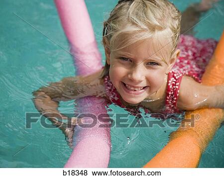 Young girl in a swimming pool. View Large Photo Image Stock Photo - Young girl in a swimming pool.. Fotosearch