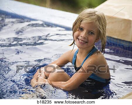 Young girl in a swimming pool. View Large Photo Image Stock Photography - Young girl in a swimming pool.. Fotosearch