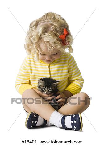 Young girl in a yellow sweater with kitten. View Large Photo Image Stock Image - Young girl in a yellow sweater with kitten.. Fotosearch