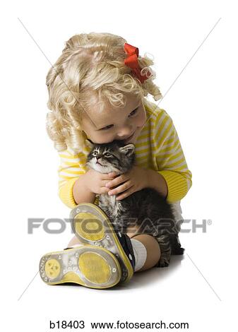 Young girl in a yellow sweater with kitten. View Large Photo Image Stock Image - Young girl in a yellow sweater with kitten.. Fotosearch