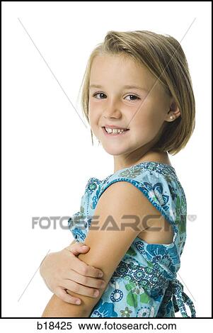 Stock Photography - Young girl with arms folded. Fotosearch
