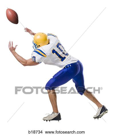 Young male American football player. View Large Photo Image Picture - Young male American football player.. Fotosearch