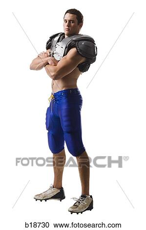 Young male American football player. View Large Photo Image Stock Image - Young male American football player.. Fotosearch