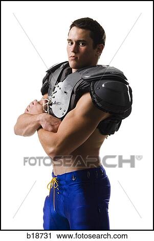Young male American football player. View Large Photo Image Stock Image - Young male American football player.. Fotosearch