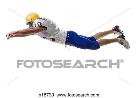 Young male American football player. View Large Photo Image Stock Image - Young male American football player.. Fotosearch