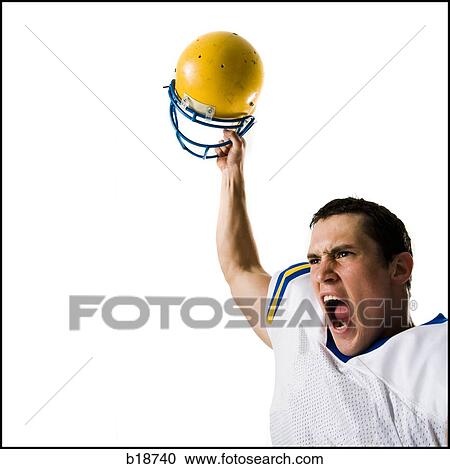 Stock Image - Young male American football player.. Fotosearch