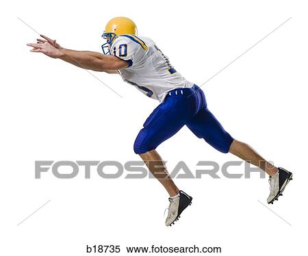 Young male American football player. View Large Photo Image Stock Photography - Young male American football player.. Fotosearch