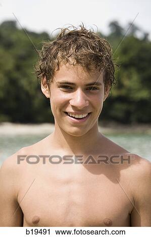 young man at the beach View Large Photo Image Stock Image - young man at the beach. Fotosearch