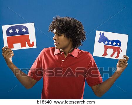 young man choosing between political parties. View Large Photo Image Stock Image - young man choosing between political parties.. Fotosearch