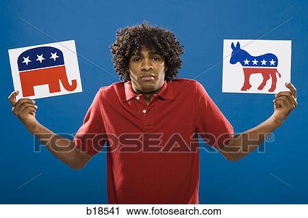 Stock Image - young man choosing between political parties.. Fotosearch