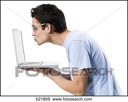 Stock Photo - young man in a blue shirt. Fotosearch