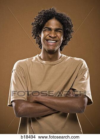 young man in a brown shirt. View Large Photo Image Picture - young man in a brown shirt.. Fotosearch