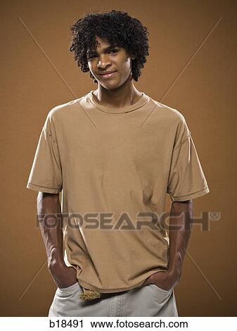 young man in a brown shirt. View Large Photo Image Stock Image - young man in a brown shirt.. Fotosearch