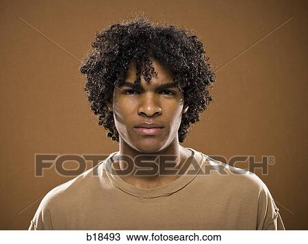 Stock Image - young man in a brown shirt.. Fotosearch