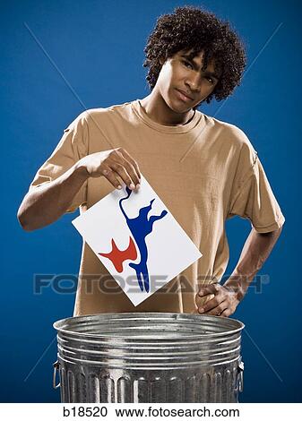young man in a brown shirt throwing away a political party symbol. View Large Photo Image Stock Image - young man in a brown shirt throwing away a political party symbol.. Fotosearch