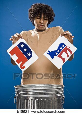 young man in a brown shirt throwing away a political party symbol. View Large Photo Image Stock Image - young man in a brown shirt throwing away a political party symbol.. Fotosearch