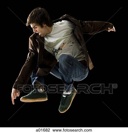 young man jumping in the air. View Large Photo Image Stock Image - young man jumping in the air.. Fotosearch