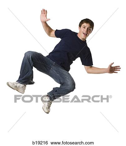 Stock Photograph - young man jumping in the air.. Fotosearch