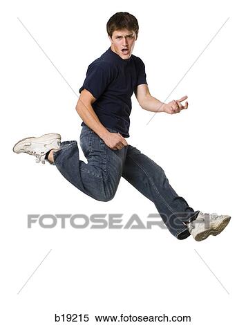 young man jumping in the air. View Large Photo Image Stock Photography - young man jumping in the air.. Fotosearch