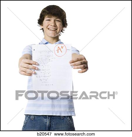 young man showing the grade he received View Large Photo Image Stock Photo - young man showing the grade he received. Fotosearch