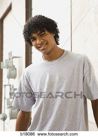 Stock Photograph - Young man smiling.. Fotosearch