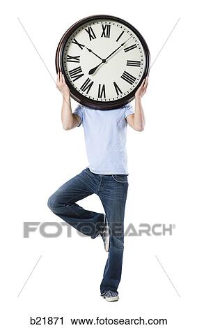 young man with a clock View Large Photo Image Stock Image - young man with a clock. Fotosearch
