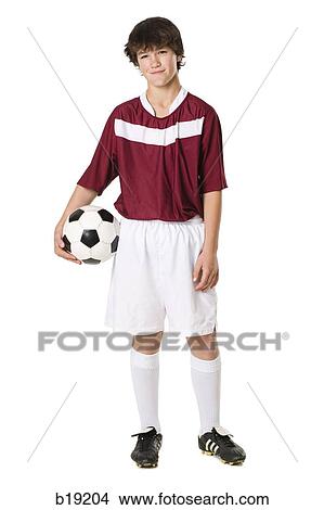 young man with a soccer ball. View Large Photo Image Picture - young man with a soccer ball.. Fotosearch