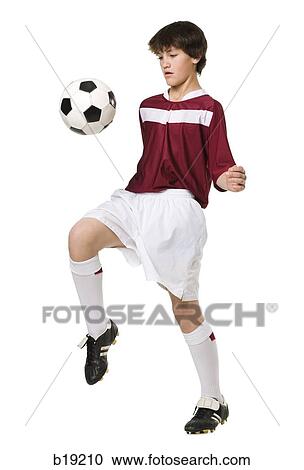 young man with a soccer ball. View Large Photo Image Stock Image - young man with a soccer ball.. Fotosearch