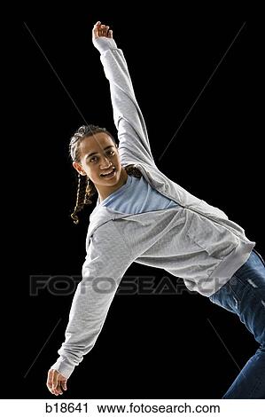 Stock Image - Young man with braids dancing.. Fotosearch