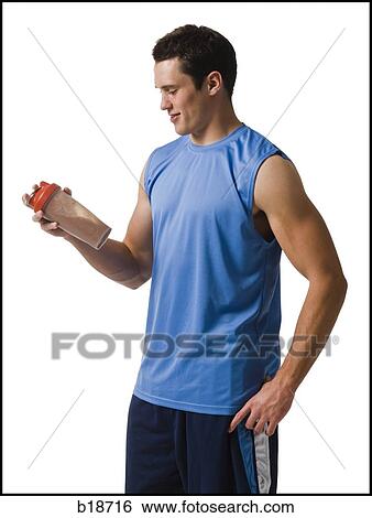 Young man working out. View Large Photo Image Stock Photograph - Young man working out.. Fotosearch
