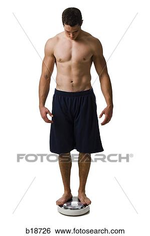 Young man working out. View Large Photo Image Stock Photograph - Young man working out.. Fotosearch