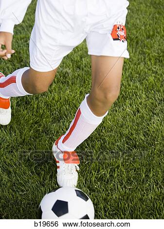 Stock Photograph - young soccer player. Fotosearch