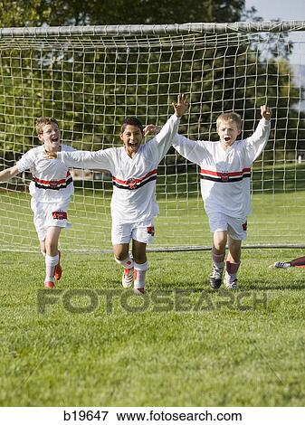 Stock Photo - young soccer players. Fotosearch