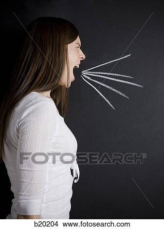 young woman against a chalkboard View Large Photo Image Picture - young woman against a chalkboard. Fotosearch