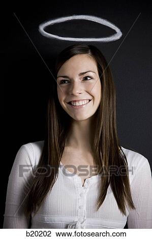 young woman against a chalkboard View Large Photo Image Stock Image - young woman against a chalkboard. Fotosearch