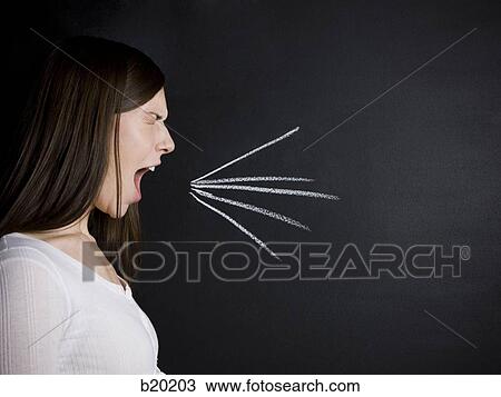 young woman against a chalkboard View Large Photo Image Stock Image - young woman against a chalkboard. Fotosearch