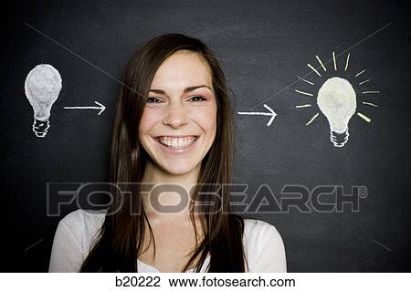young woman against a chalkboard View Large Photo Image Stock Image - young woman against a chalkboard. Fotosearch