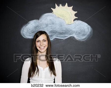 young woman against a chalkboard View Large Photo Image Stock Image - young woman against a chalkboard. Fotosearch