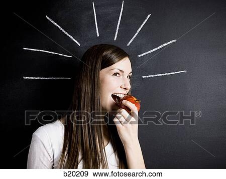 young woman against a chalkboard View Large Photo Image Stock Photo - young woman against a chalkboard. Fotosearch