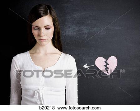 young woman against a chalkboard View Large Photo Image Stock Photo - young woman against a chalkboard. Fotosearch