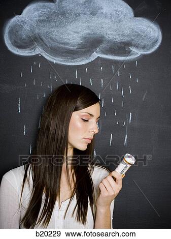 young woman against a chalkboard View Large Photo Image Stock Photo - young woman against a chalkboard. Fotosearch