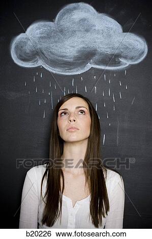 young woman against a chalkboard View Large Photo Image Stock Photograph - young woman against a chalkboard. Fotosearch