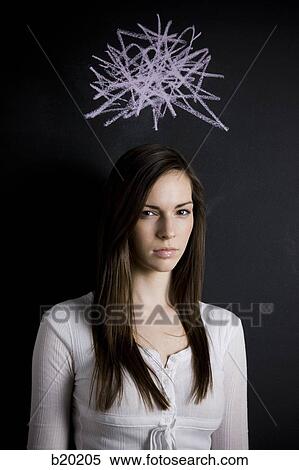 Stock Photography - young woman against a chalkboard. Fotosearch