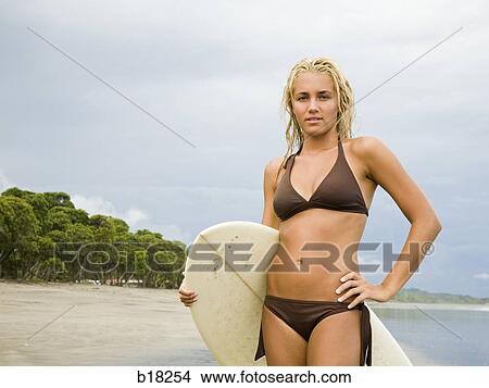 Picture - Young woman at the beach.. Fotosearch