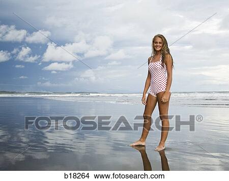Picture - Young woman at the beach.. Fotosearch