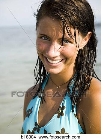 Picture - Young woman at the beach.. Fotosearch
